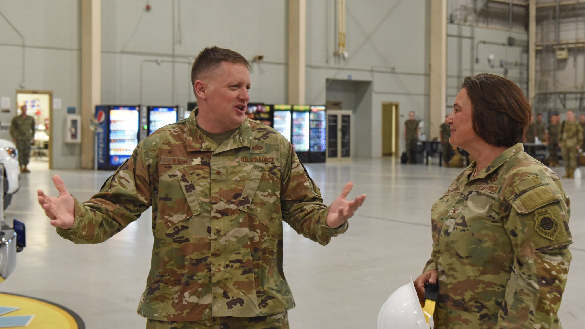 U.S. Air Force Brig. Gen. William Kale III, Air Force Director of Civil Engineers, talks with Col. Angelina Maguinness, 17th Training Group commander.  Kale coordinated with Maguinness to see firsthand the training of Air Force firefighters at the Louis F. Garland Department of Defense Fire Academy. (U.S. Air Force photo by Airman 1st Class Zachary Heimbuch)