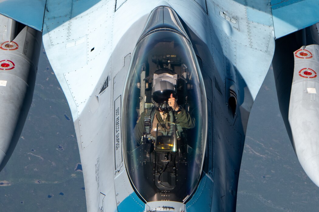 An F-16 performs aerial refueling operations.