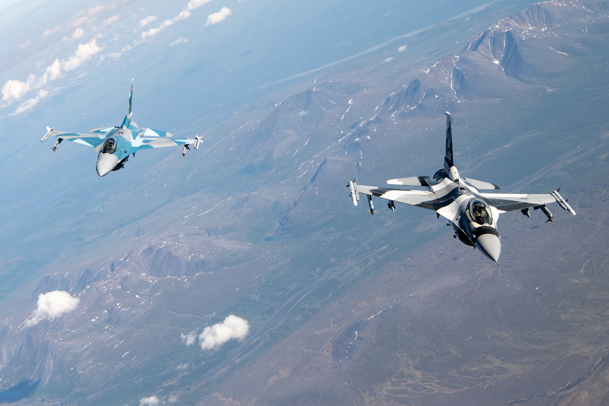 An F-16 performs aerial refueling operations.