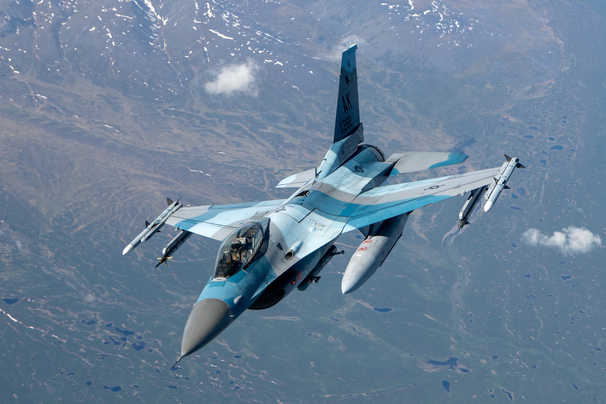 An F-16 performs aerial refueling operations.