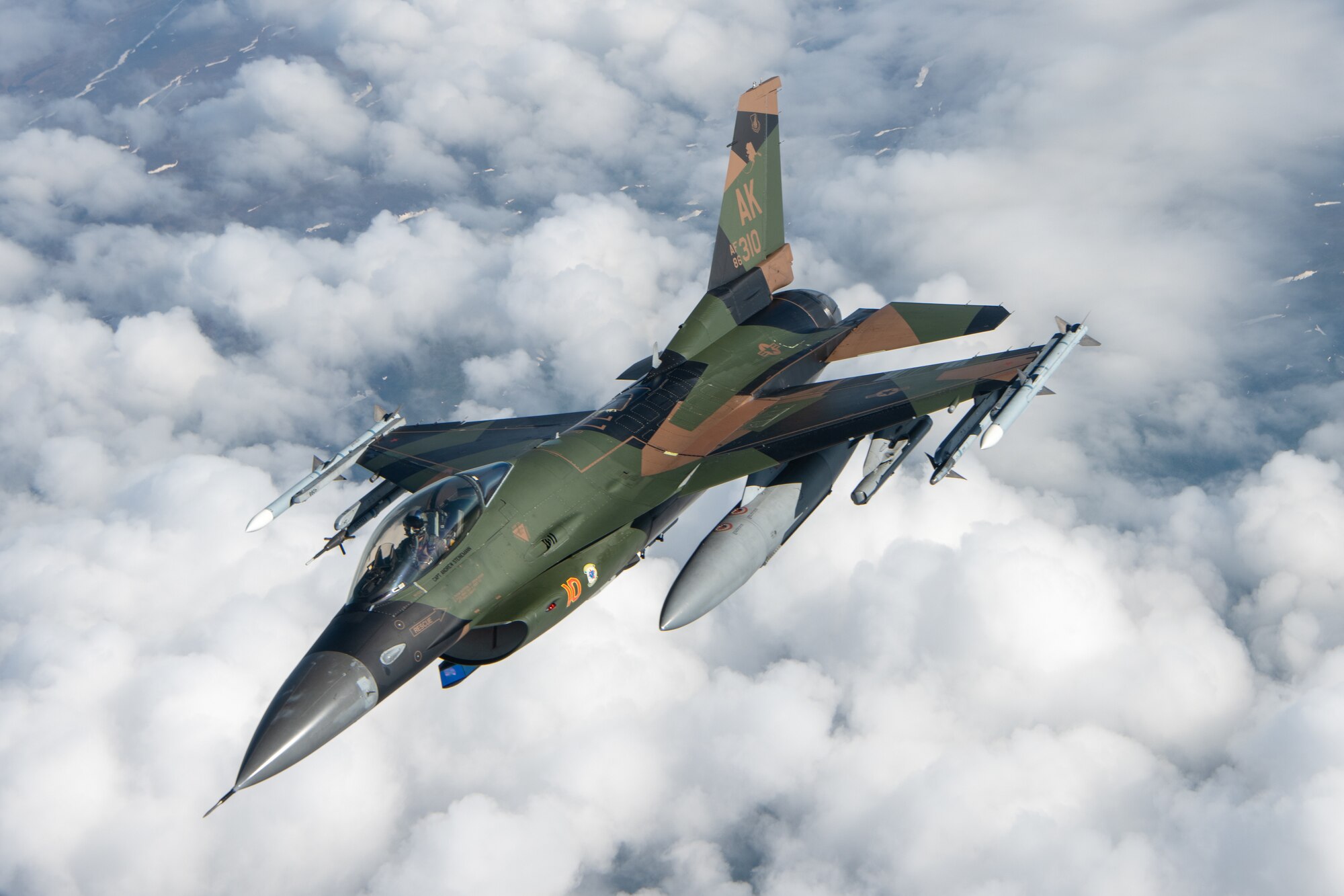 An F-16 performs aerial refueling operations.