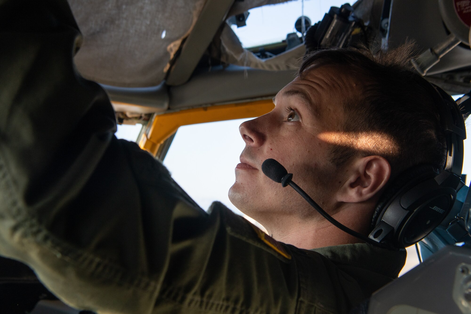 A pilot performs pre-flight checks.