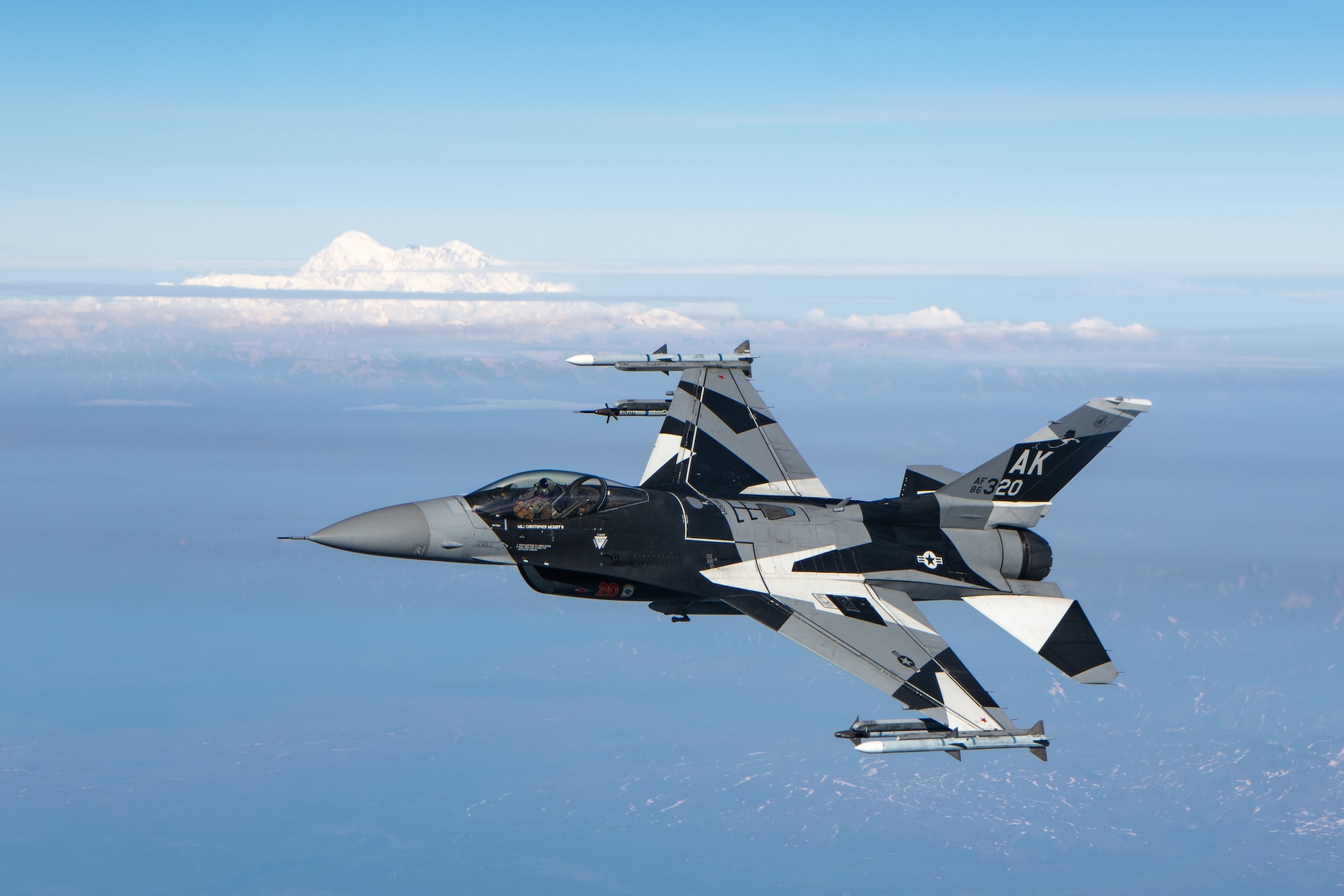 An F-16 performs aerial refueling operations.