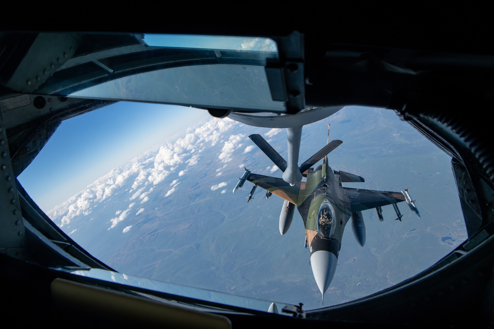 An F-16 performs aerial refueling operations.