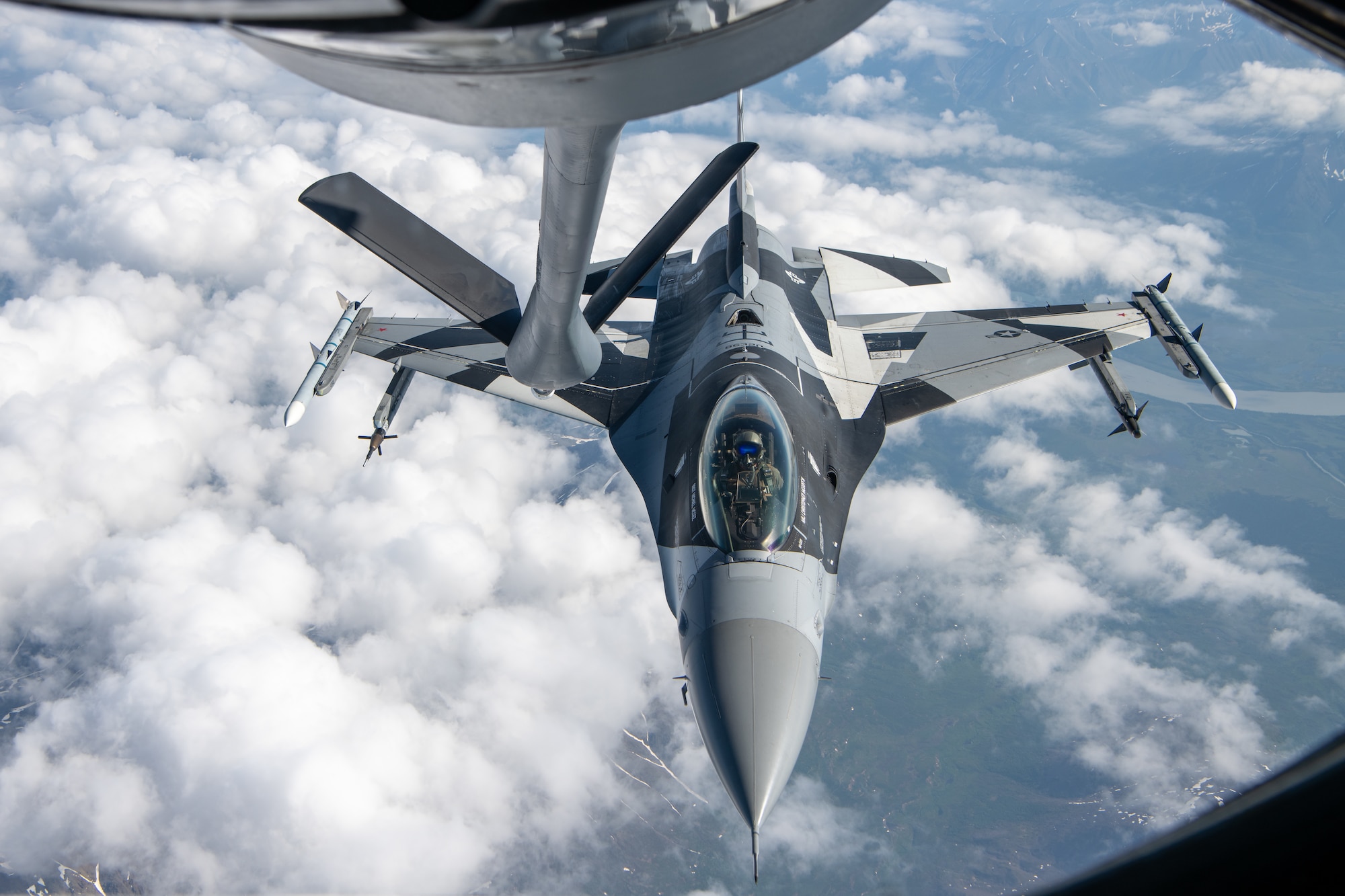 An F-16 performs aerial refueling operations.