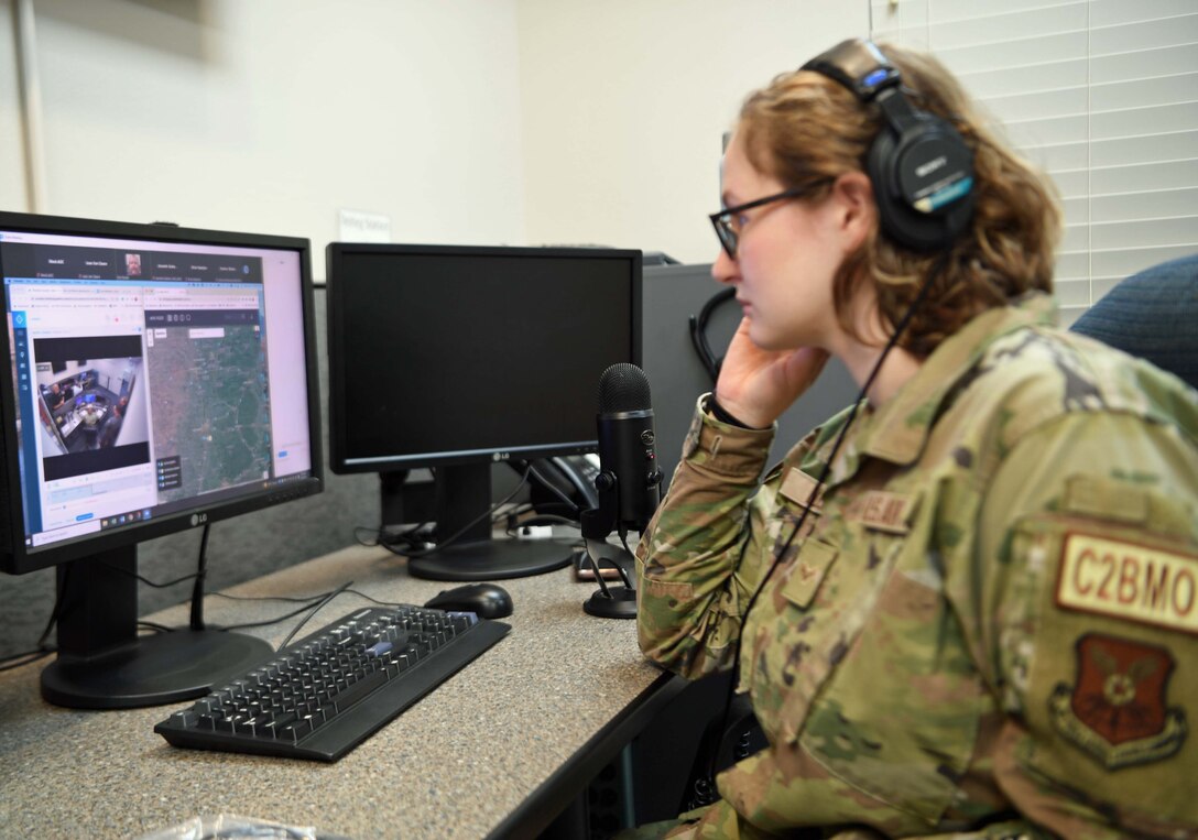 Airman 1st Class Leah Butler, a 608th Air Operations Center offensive duty technician, monitors the B-52 Stratofortress path and audio relay during an IRIS aerial demonstration in Shreveport, La., June 22, 2022. IRIS is a beyond line-of-sight communications system and allowed the bomber to transfer data, voice and imagery in near real time speeds. (U.S. Air Force photo by Justin Oakes)