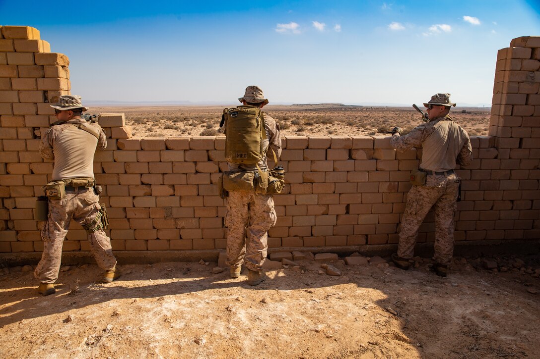 U.S. Marines assigned to Echo Company, Battalion Landing Team 2/6, 22nd Marine Expeditionary Unit, set up security for a dry-fire training event during exercise African Lion 22, Tunisia, June 21, 2022. African Lion 22 is a multinational-scale exercise focused on increasing training and interoperability between the U.S. partners and allies in Africa to work towards increased security and stability within the region. (U.S. Marine Corps photo by Lance Cpl. Cameron Ross)