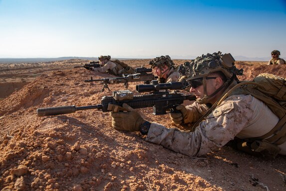 U.S. Marines assigned to Echo Company, Battalion Landing Team 2/6, 22nd Marine Expeditionary Unit, set up security down range for a dry-fire training event during exercise African Lion 22, Tunisia, June 21, 2022. African Lion 22 is a multinational-scale exercise focused on increasing training and interoperability between the U.S. partners and allies in Africa to work towards increased security and stability within the region. (U.S. Marine Corps photo by Lance Cpl. Cameron Ross)