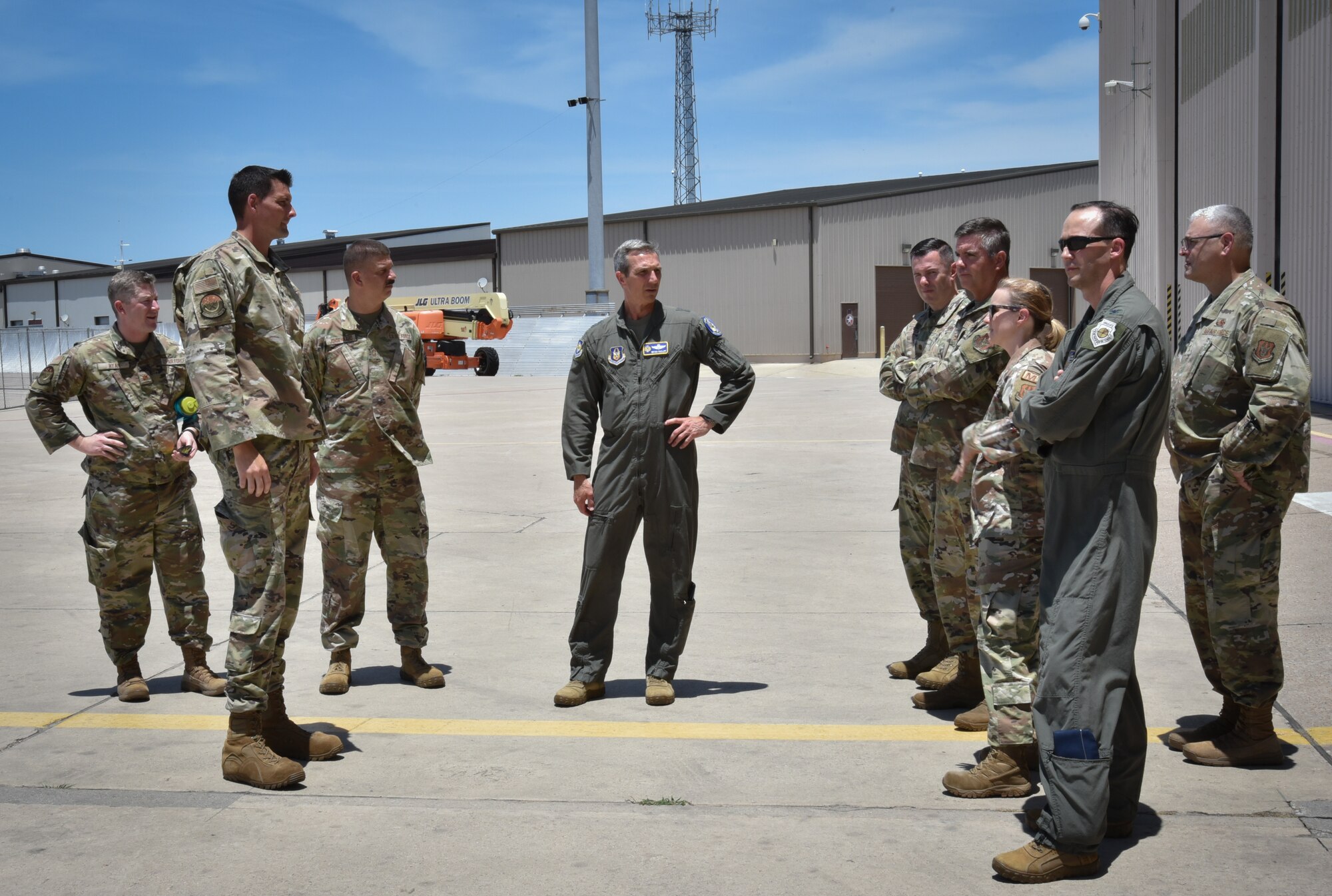Leadership from the 301st Maintenance Group speak with Maj. Gen Bryan R. Radliff at Naval Air Station Joint Reserve Base Fort Worth, Texas, June 5, 2022. The 301 FW was selected to become Air Force Reserve Command’s first ever owned and operated F-35A Lightning II unit in 2021. Radliff met with the 301 MXG leadership to gain a better understanding of the wing’s F-35 beddown process.(U.S. Air Force photo by Staff Sgt. Nije Hightower)