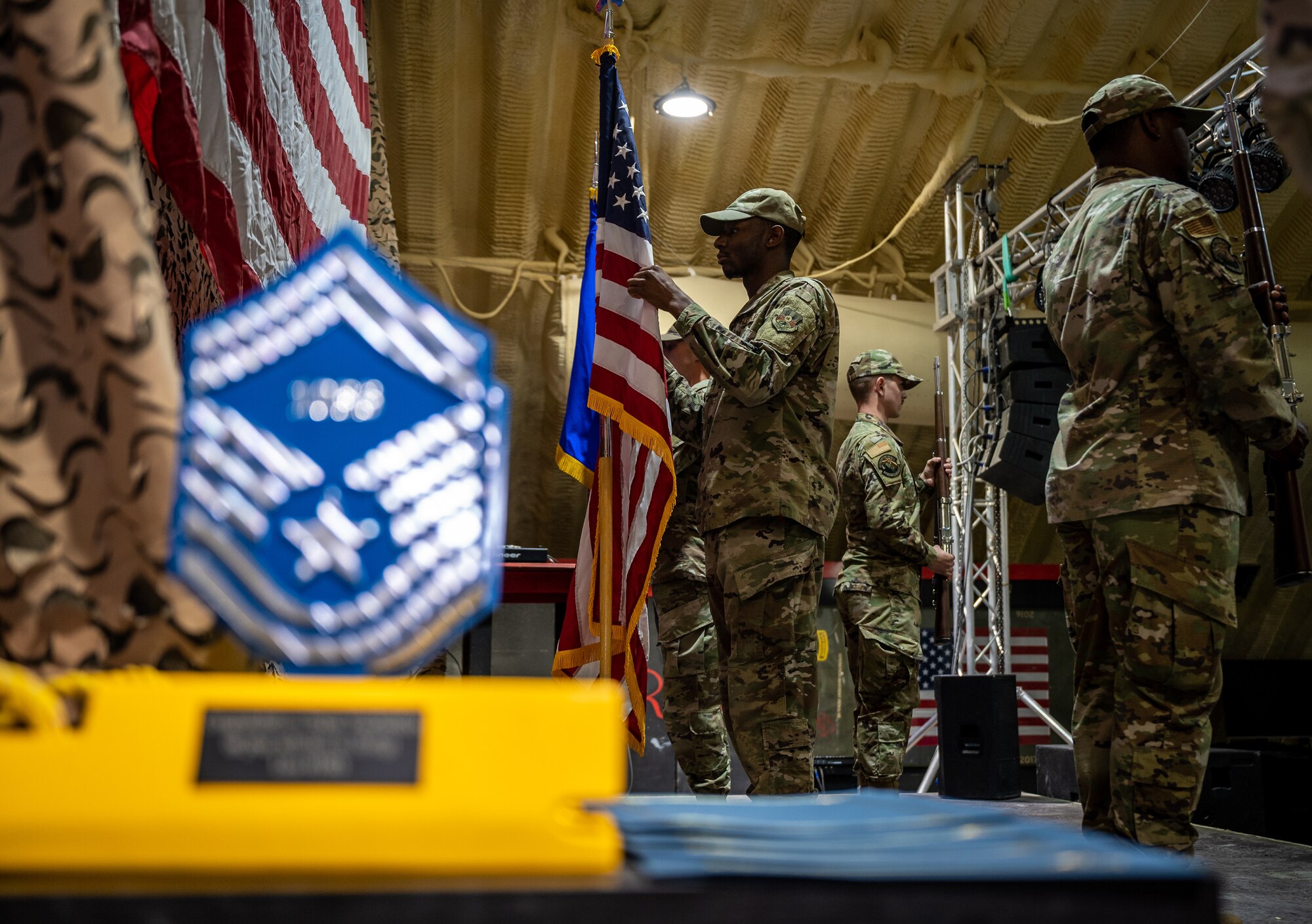 The 332d Air Expeditionary Wing Base Honor Guard presents the colors during the senior master sergeant release ceremony at an undisclosed location in Southwest Asia, March 19, 2022. The Honor Guard provides military ceremonial support and dignified transfer support when called upon. (U.S. Air Force photo by Master Sgt. Christopher Parr)