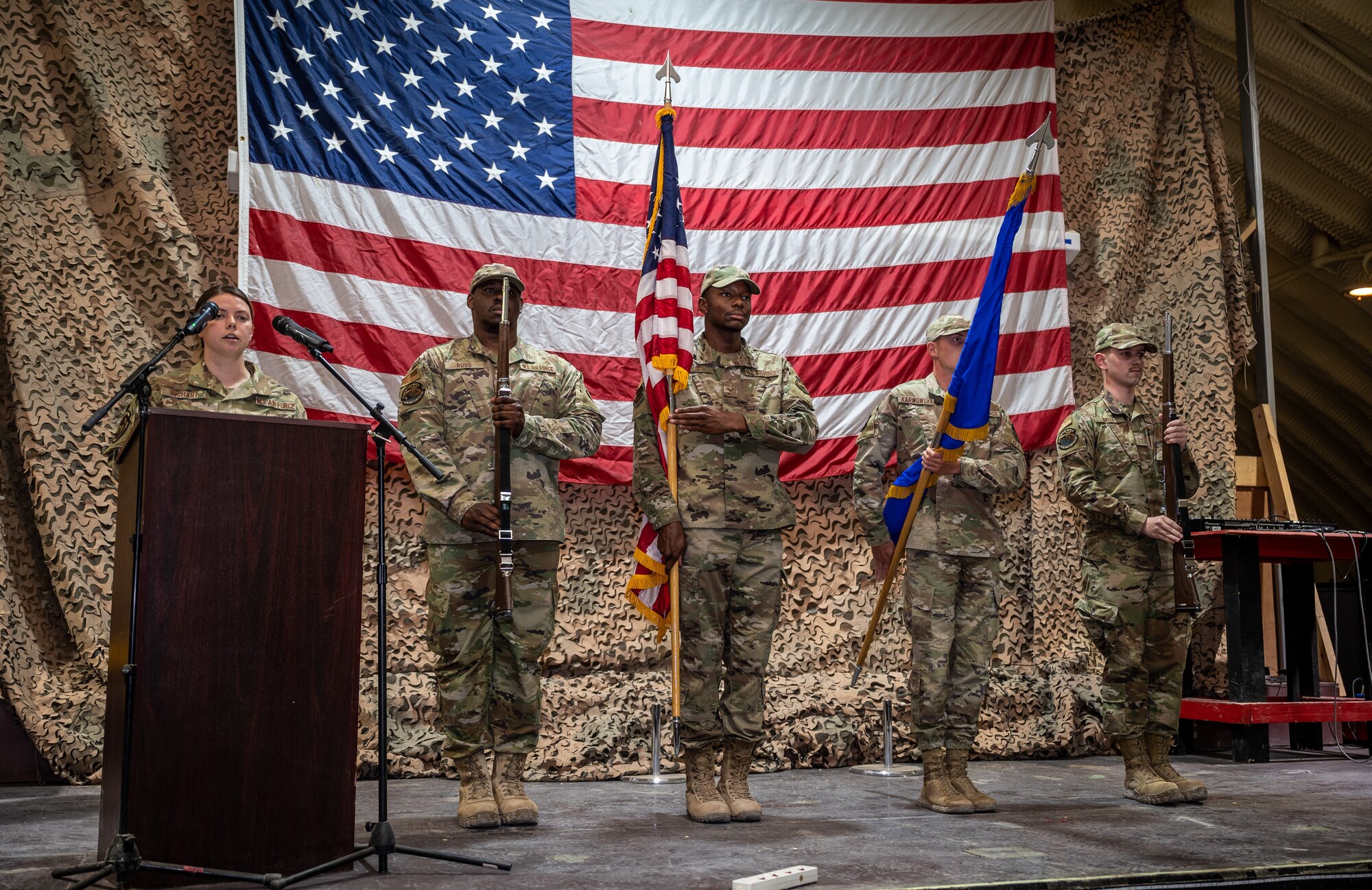 The 332d Air Expeditionary Wing Base Honor Guard presents the colors during the senior master sergeant release ceremony at an undisclosed location in Southwest Asia, March 19, 2022. The Honor Guard provides military ceremonial support and dignified transfer support when called upon. (U.S. Air Force photo by Master Sgt. Christopher Parr)