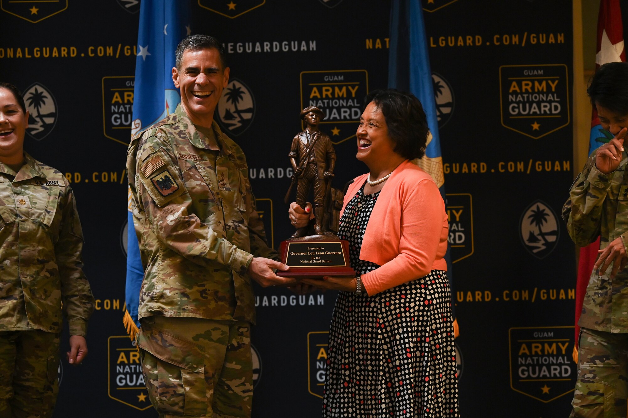 U.S. Air Force Lt. Gen. Marc Sasseville, vice chief of the National Guard Bureau, presents an award to Lou Leon Guerrero, Guam governor, on Guam National Guard Headquarters, Barrigada, June 22, 2022.