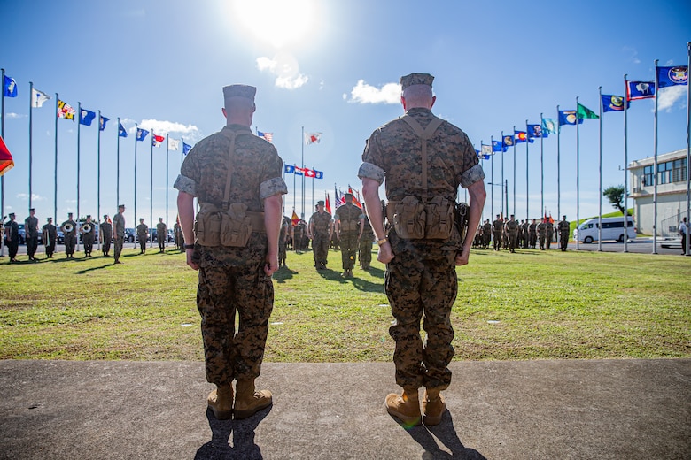 U.S. Marine Corps Maj. Gen. William J. Bowers, right, outgoing commanding general, Marine Corps Installations Pacific, Marine Corps Base Camp Butler, and Maj. Gen. Stephen E. Liszewski, left, incoming commanding general, MCIPAC, MCBB, stand during a change of command ceremony outside of MCIPAC’s Headquarters Building, Camp Foster, Okinawa, Japan, on June 24, 2022. Change of command ceremonies allow individuals to witness the official passing of authority change between officers. During the ceremony, the outgoing commander passes the unit’s guidon to the incoming commander, symbolizing the transfer of authority, responsibility, and total commitment to all Marines and Sailors. (U.S. Marine Corps photo by Cpl. Alex Fairchild)