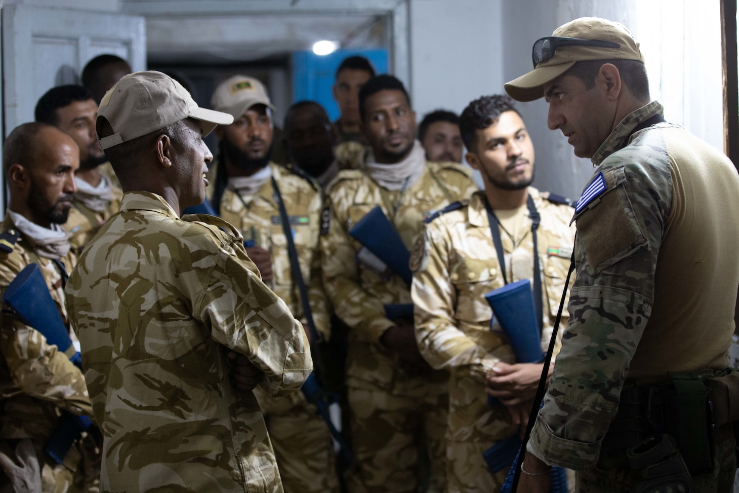 BIZERTE, Tunisia (May 24, 2022) NATO Maritime Interdiction Training Center cross-train tactical sweep maneuvers with the Mauritanian Boarding Team during exercise Phoenix Express 2022 in Bizerte, Tunisia, on May 24, 2022. Phoenix Express 22, conducted by U.S. Naval Forces Africa, is a maritime exercise designed to improve cooperation among participating nations in order to increase maritime safety and security in the Mediterranean. (U.S. Navy Photo by Mass Communication Specialist Petty Officer 2nd Class Timothy Haggerty/Released)