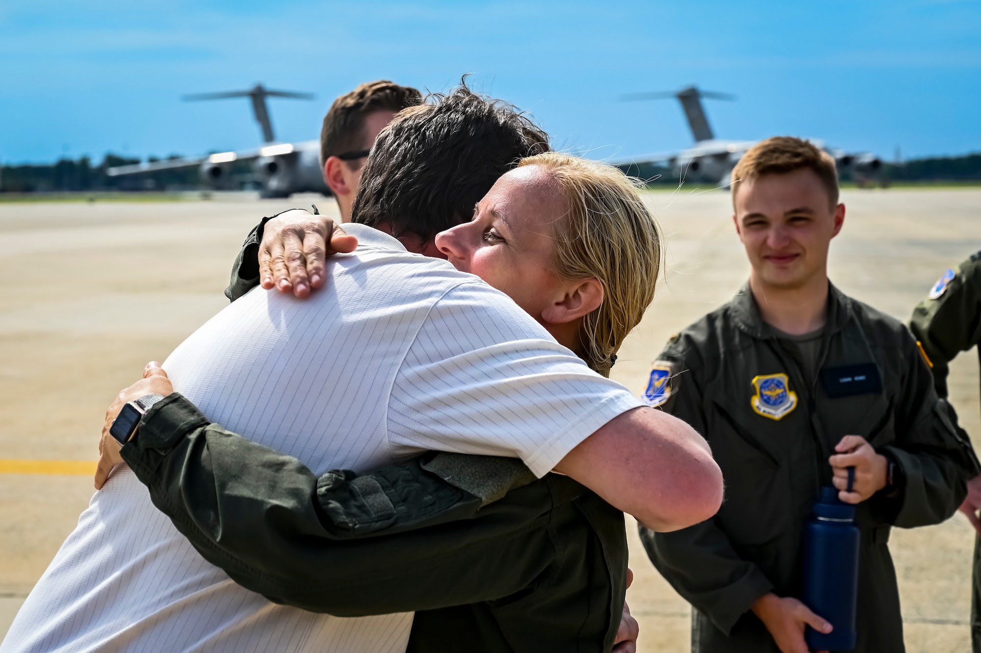 U.S. Air Force Colonel Michele Lo Bianco, 305th Operations Group commander, embraces a colleague following a fini flight on June 21, 2022 at Joint Base McGuire-Dix-Lakehurst, N.J. Lo Bianco will serve as the 15th Wing commander at Joint Base Pearl Harbor-Hickam.