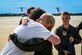 U.S. Air Force Colonel Michele Lo Bianco, 305th Operations Group commander, embraces a colleague following a fini flight on June 21, 2022 at Joint Base McGuire-Dix-Lakehurst, N.J. Lo Bianco will serve as the 15th Wing commander at Joint Base Pearl Harbor-Hickam.