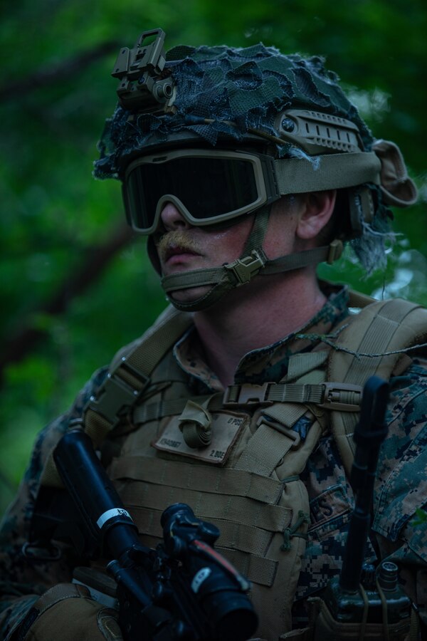 Cpl. Kevin Humphrey, a Field Radio Operator with 2nd Air Naval Gunfire Liaison Company, II Marine Expeditionary Force Information Group, Marine Forces Reserve, provides surveillance after a fast-roping exercise at Gunslinger 22 in Riley, Kansas, June 21, 2022. Exercise Gunslinger 22 is a joint exercise with the Kansas Air National Guard and U.S. Marine Corps designed to increase aircraft control and training for potential real world contingencies. (U.S. Marine Corps photo by Cpl. Jonathan L. Gonzalez)