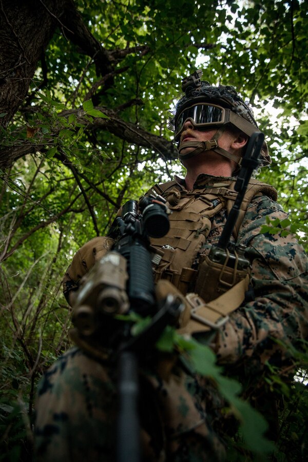 U.S. Marine Corps Cpl. Kevin Humphrey, a field radio operator with 2nd Air Naval Gunfire Liaison Company (ANGLICO), II Marine Expeditionary Force Information Group, Marine Forces Reserve, from Sacramento, California, provides surveillance after fast-roping out of a CH-53E Super Stallion during exercise Gunslinger 22 in Riley, Kansas, June 21, 2022. The Marines with 2nd ANGLICO partnered alongside soldiers from the 10th Air Support Operations Squadron in a fast-rope exercise. Exercise Gunslinger 22 is a joint exercise with the Kansas Air National Guard and U.S. Marine Corps designed to increase aircraft control and training for potential real-world contingencies. (U.S. Marine Corps photo by Lance Cpl. David Intriago)