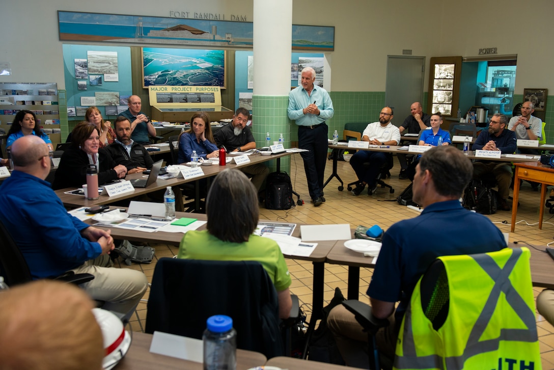 Members of the U.S. Army Corps of Engineers Omaha District and the Voith group discuss their new collaboration project on the hydropower plant project at the Fort Randall Dam, South Dakota, June 7, 2022. The meeting allowed for discussion of the project and partnership, reviewing of outcomes from the pre-session survey, and identifying project key success factors, among other things. (U.S. Army Corps of Engineers Photo by Jason Colbert)