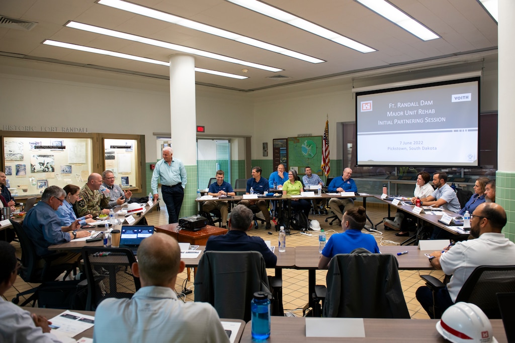 Members of the U.S. Army Corps of Engineers Omaha District and the Voith group discuss their new collaboration project on the hydropower plant project at the Fort Randall Dam, South Dakota, June 7, 2022. The meeting allowed for discussion of the project and partnership, reviewing of outcomes from the pre-session survey, and identifying project key success factors, among other things. (U.S. Army Corps of Engineers Photo by Jason Colbert)