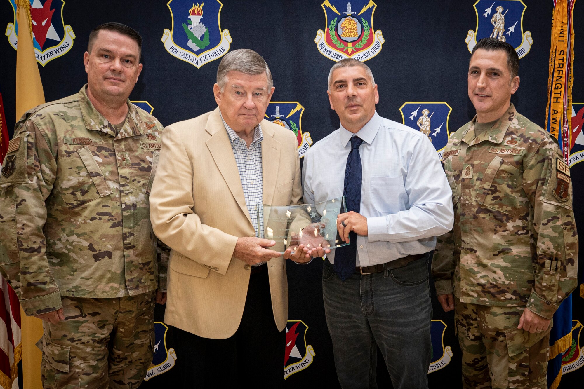 The New Jersey Air National Guard held their annual awards ceremony on Joint Base McGuire-Dix-Lakehurst, New Jersey, June 22, 2022. Chief Master Sgt. Carmine "G" Giangeruso, 108th Wing, is presented with the 2021 MG Richard "Craig" Cosgrave Chief's Award by Maj. Gen. Cosgrave, Brig. Gen. Patrick Kennedy and State Command Chief Master Sgt. Michael Rakauckas.