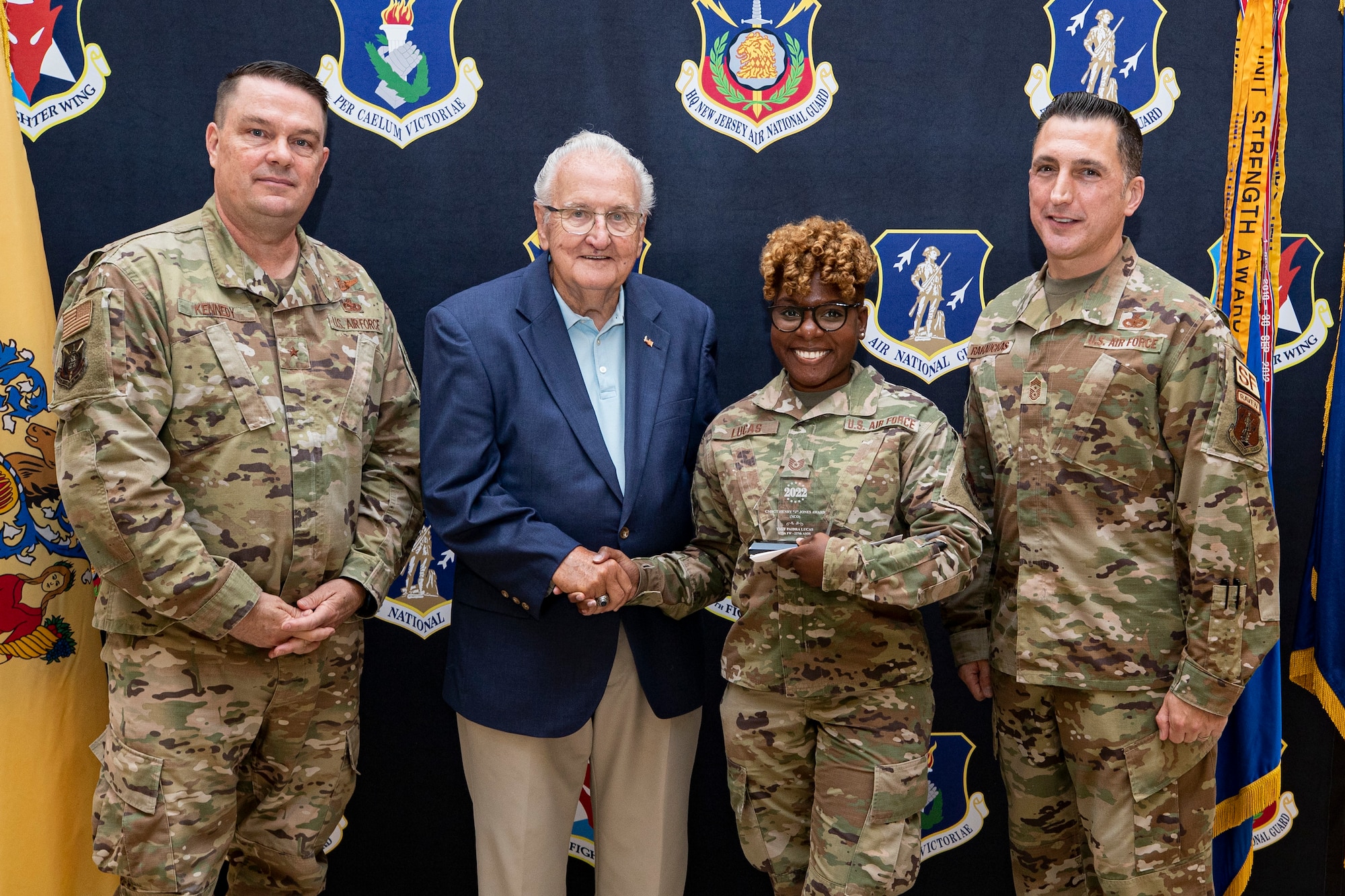 The New Jersey Air National Guard held their annual awards ceremony on Joint Base McGuire-Dix-Lakehurst, New Jersey, June 22, 2022. Tech. Sgt. Paidra Lucas, 227th Air Support Operations Squadron, is presented with the 2021 CMSgt Henry "J" Jones Award by Brig. Gen. (Ret.) Robert Dutko, Brig. Gen. Patrick Kennedy and State Command Chief Master Sgt. Michael Rakauckas.