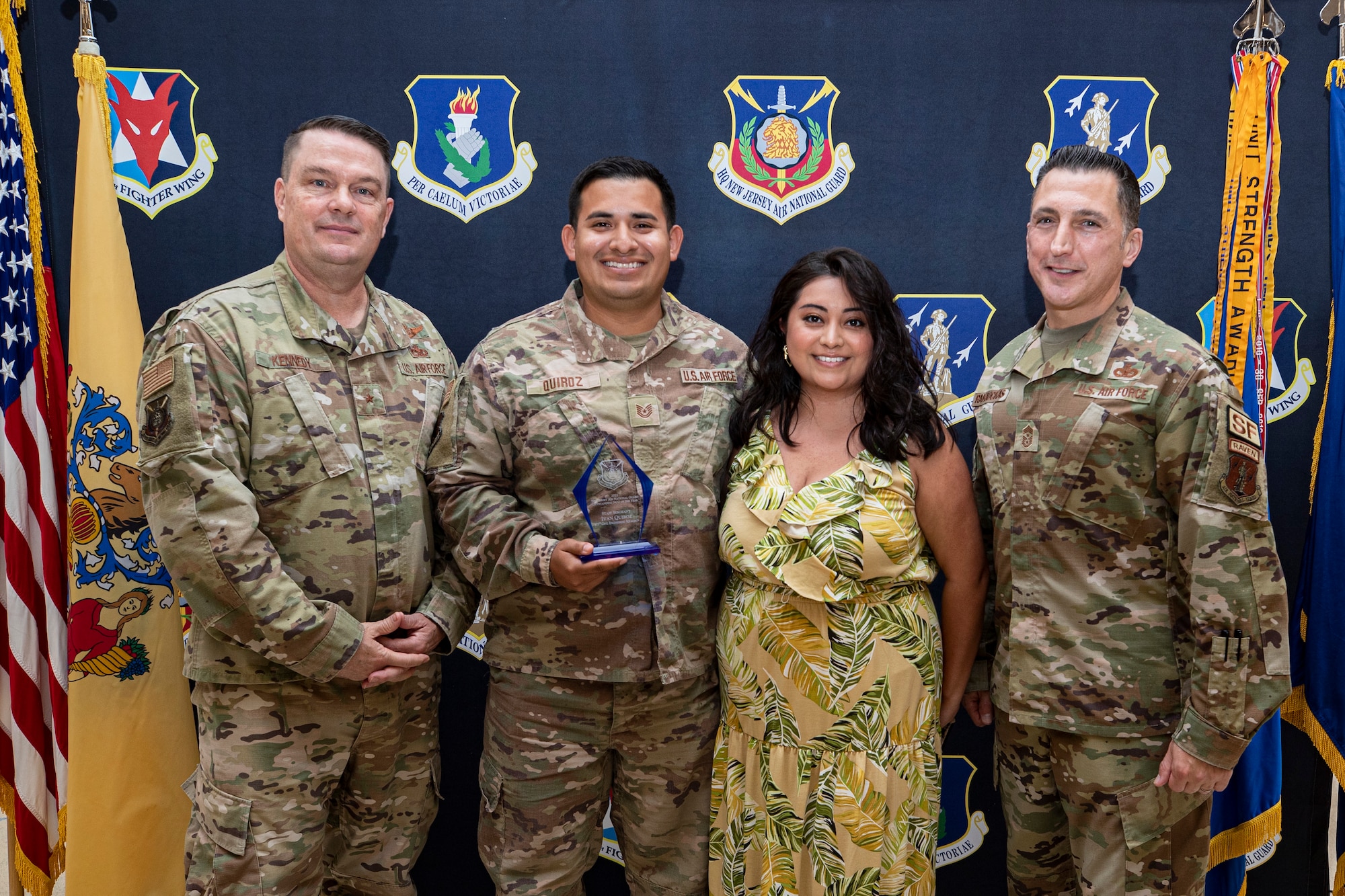 The New Jersey Air National Guard held their annual awards ceremony on Joint Base McGuire-Dix-Lakehurst, New Jersey, June 22, 2022. Master Sgt. Justin Kaenzig, Tech. Sgt. Ivan Quiroz, 177th Civil Engineering Squadron, is presented with the 2021 Outstanding NCO of the Year award by Brig. Gen. Patrick Kennedy and State Command Chief Master Sgt. Michael Rakauckas.