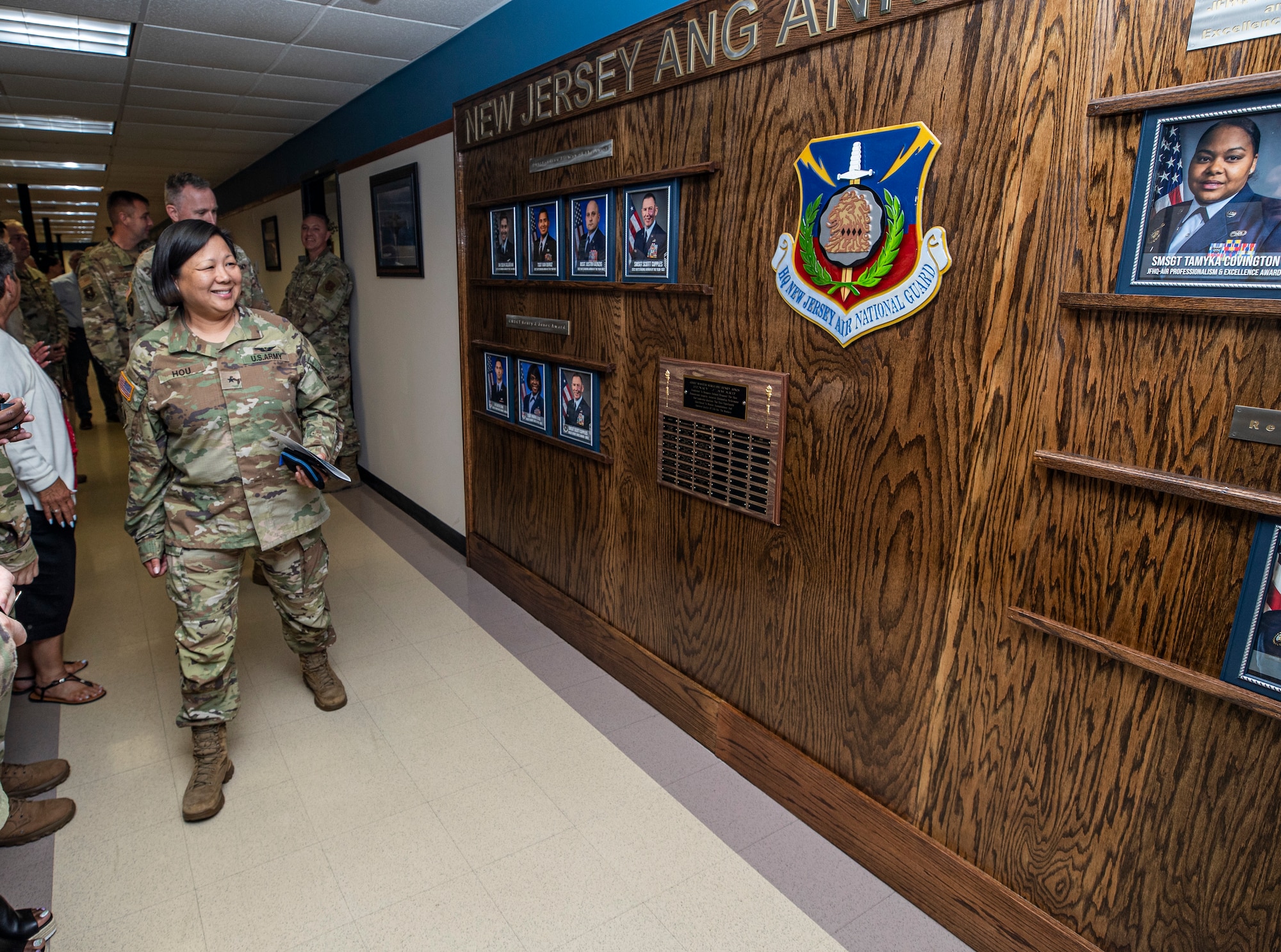 U.S. Army Brig. Gen. Lisa Hou, D.O., the Adjutant General of New Jersey, and Commissioner of the New Jersey Department of Military and Veterans Affairs looks at the New Jersey Air National Guard's Awards Wall during its unveiling on June 22, 2022.