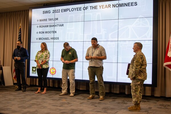 U.S. Army Corps of Engineers (USACE), Galveston District Commander Col. Tim R. Vail [far right] gets ready to present the District's "Employee of the Year" award to one of four nominees during a quarterly awards ceremony June 23.