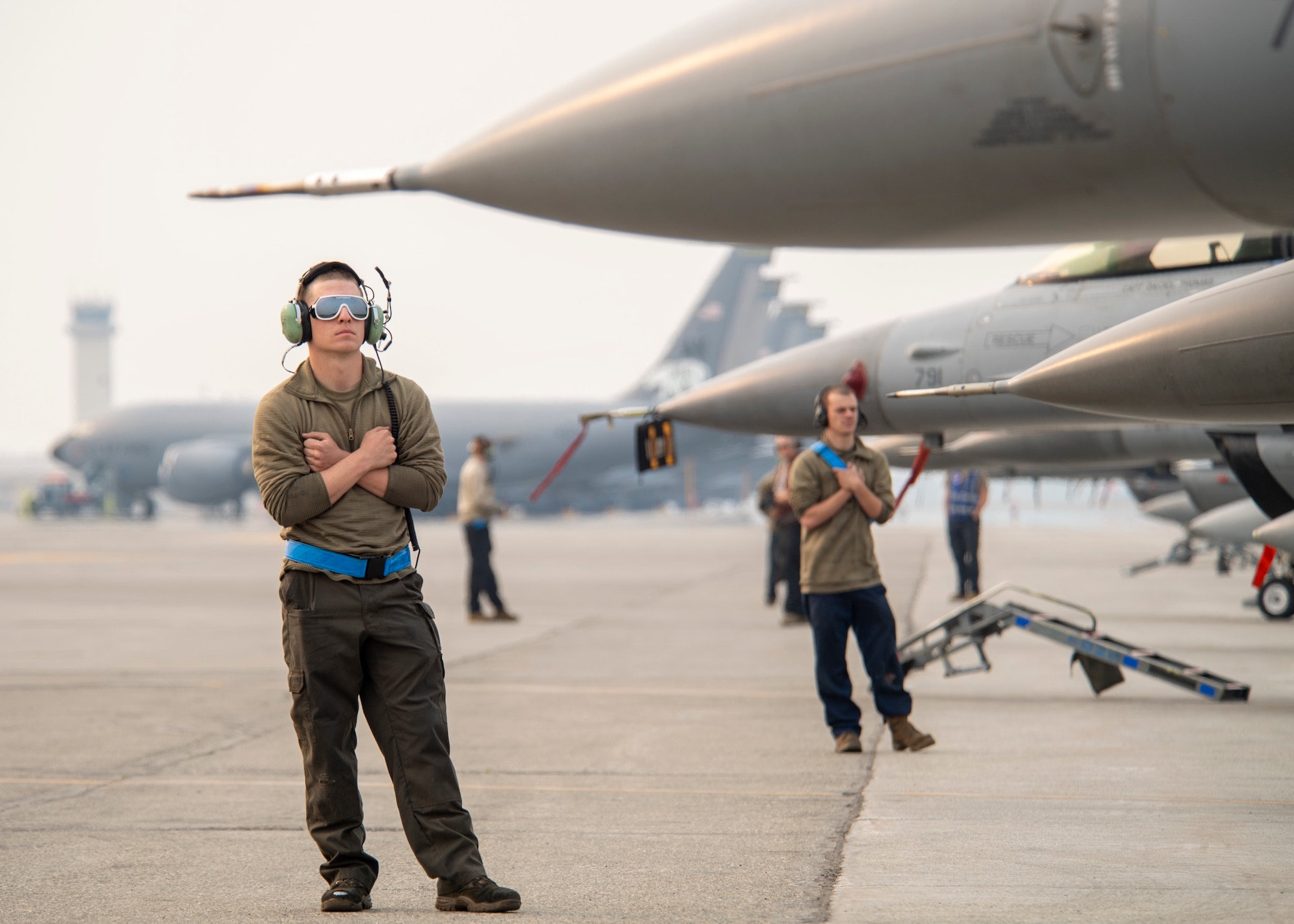 U.S. Air Force Airman 1st Class Landon Grizzel, 35th Aircraft Maintenance Unit F-16 crew chief, gives a wait signal to the pilot of a F-16 Fighting Falcon belonging to the 35th Fighter Squadron, Kunsan Air Base, Republic of Korea, as part of the Red Flag 22-2 exercise at Eielson Air Force Base, Alaska, June 14, 2022. Known as the “Pantons”, the 35th FS performs air and space control and force application roles including counter air, strategic attack, interdiction, and close-air support missions. It employs a full range of precision ordnance, can operate day or night and in all weather conditions. The Red Flag Exercise was established in 1975 and serves as a two-week advanced aerial combat training exercise held multiple times a year by the USAF, alongside joint partner and allied air and ground forces. (U.S. Air Force photo by Staff Sgt. Ryan Lackey)