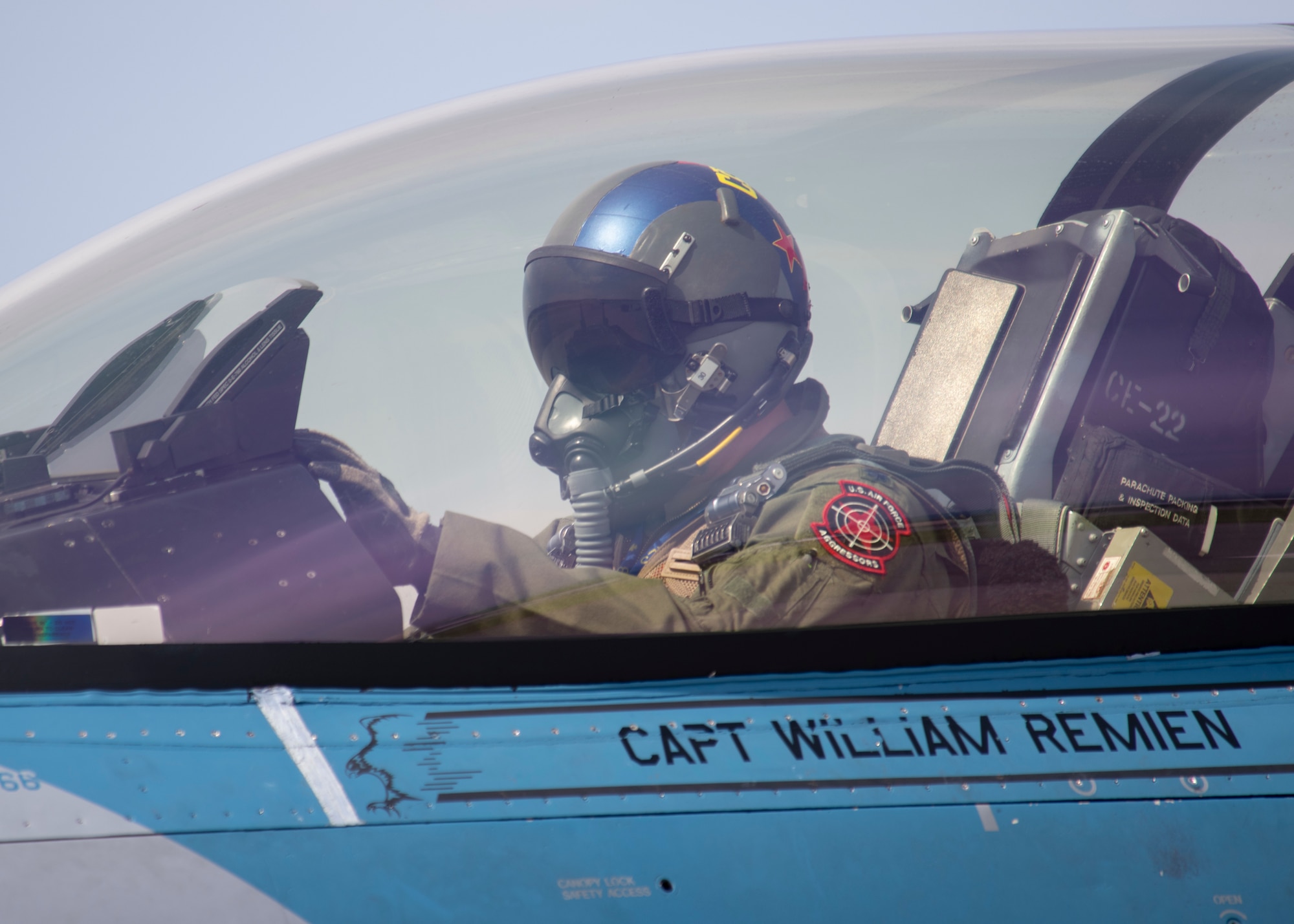 U.S. Air Force Lt. Col. Christopher “Coach” McGoffin, 18th Aggressor Squadron F-16 Fighting Falcon pilot, preps his display before a training sortie as part of the Red Flag 22-2 exercise at Eielson Air Force Base, Alaska, June 16, 2022. The Aggressors are dedicated to playing the “red team” adversaries against “blue team” allies during Red Flag aerial training missions. The Red Flag Exercise was established in 1975 and serves as a two-week advanced aerial combat training exercise held multiple times a year by the USAF, alongside joint partner and allied air and ground forces. (U.S. Air Force photo by Staff Sgt. Ryan Lackey)