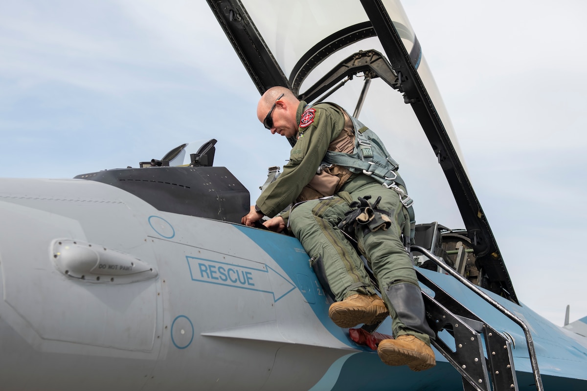 U.S. Air Force Lt. Col. Christopher “Coach” McGoffin, 18th Aggressor Squadron F-16 Fighting Falcon pilot, boards his aircraft before a training sortie as part of the Red Flag 22-2 exercise at Eielson Air Force Base, Alaska, June 16, 2022. The Aggressors are dedicated to playing the “red team” adversaries against “blue team” allies during Red Flag aerial training missions. The Red Flag Exercise was established in 1975 and serves as a two-week advanced aerial combat training exercise held multiple times a year by the USAF, alongside joint partner and allied air and ground forces. (U.S. Air Force photo by Staff Sgt. Ryan Lackey)
