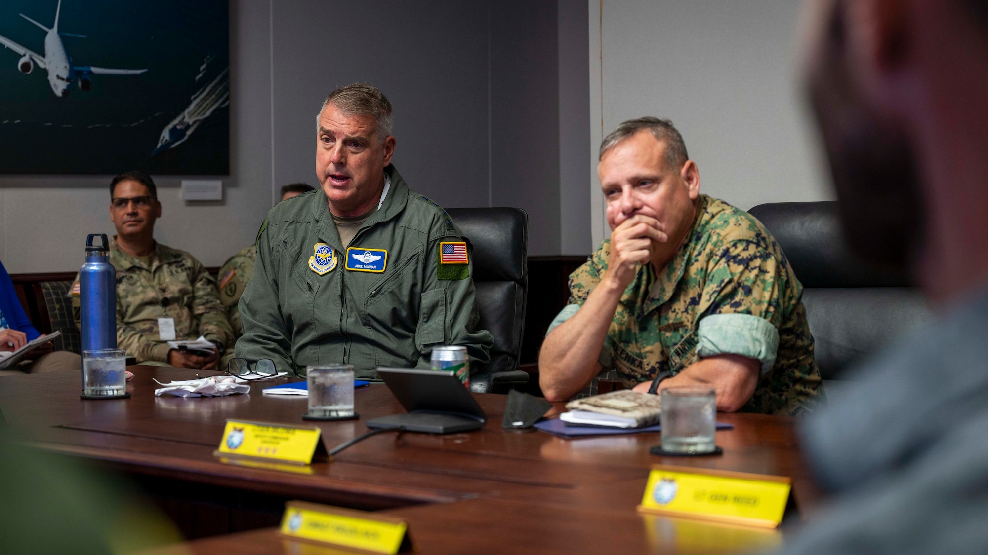 CAMP H.M. SMITH, Hawaii (June 23, 2022) Gen. Michael Minihan, Commander of Air Mobility Command, left, delivers remarks during a meeting at USINDOPACOM headquarters. AMC leaders met with USINDOPACOM as well as their Pacific Air Forces counterparts to present a road map for readying Mobility Air Forces for Agile Combat Employment in the Indo-Pacific theater. (U.S. Navy photo by Mass Communication Specialist 1st Class Anthony J. Rivera)