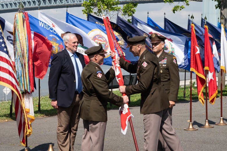 Lt. Gen. Scott A. Spellmon, Commanding General of the U.S. Army Corps of Engineers, passes the North Atlantic Division's colors to the incoming commander, Col. John P. Lloyd June 24, 2022, during a change of command ceremony at Fort Hamilton's Bluff Park in New York.