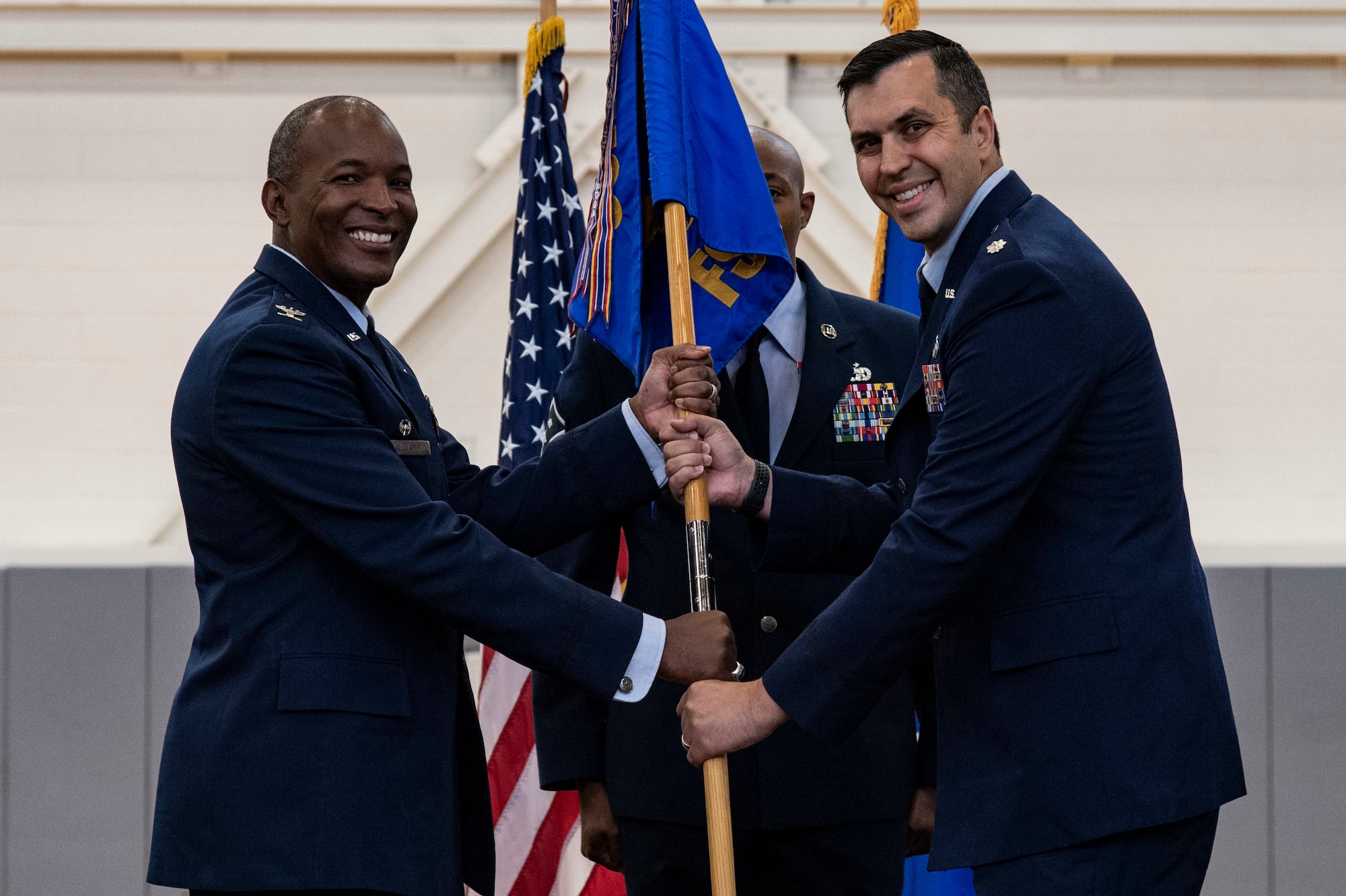 Lt. Col. Donald Johnson III, right, 436th Force Support Squadron commander, assumes command of the 436th FSS from Col. Phelemon Williams, left, 436th Mission Support Group commander, during a change of command ceremony held at the base fitness center on Dover Air Force Base, Delaware, June 24, 2022. Team Dover Airmen, family members and guests watched Johnson assume command of the 436th FSS. Guidon bearer for the ceremony was Master Sgt. Perry Hardy, 436th FSS first sergeant. (U.S. Air Force photo by Roland Balik)