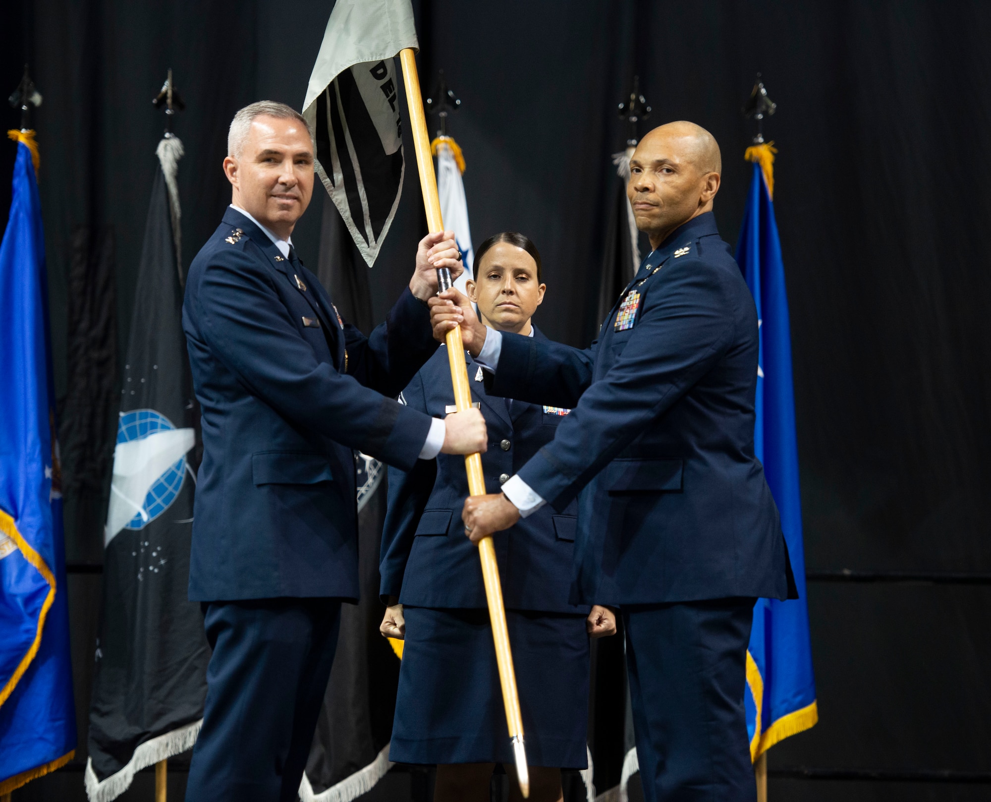 U.S. Space Force Colonel Marqus Randall, Space Delta 18 commander, takes Space Delta 18's guidon for the first time at the activation ceremony for Space Operations Command's newest Delta, Space Delta 18, and established the National Space Intelligence Center (NSIC) at the Nutter Center, Dayton, Ohio, June 24, 2022. Space Delta 18 is named in honor of the U.S. Space Force's role as the 18th member of the intelligence community. Delta 18 will deliver critical intelligence on threat systems, foreign intentions, and activities in the space domain to support national leaders, allies, partners and joint war fighters. (U.S. Space Force photo by SrA Jack Gardner)