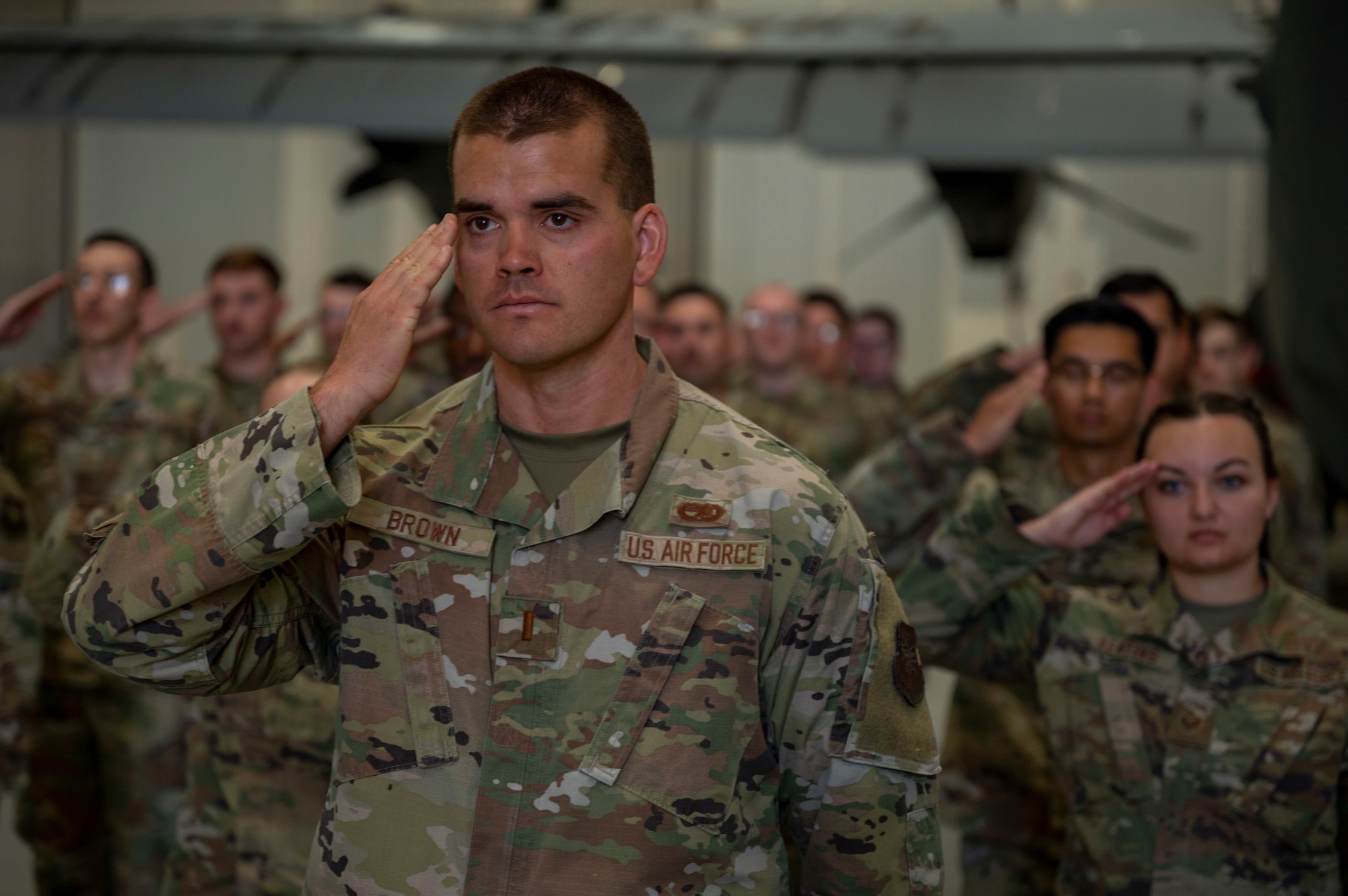 2nd Lt. Christopher Brown, 317th Maintenance Squadron maintenance officer, renders the final salute to Maj. Andrew Brock as the 317th MXS commander during a change of command ceremony at Dyess Air Force Base, Texas, 17 Jun 2022. Changes of command in the military are a tradition that formally represent the transfer of authority from one leader to another. (U.S. Air Force photo by Senior Airman Reilly McGuire)
