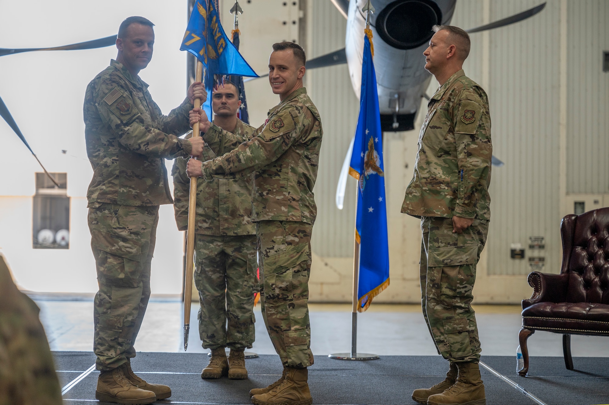 Col. Jeffrey Darden, 317th Maintenance Group commander, takes the Guidon from Maj. Andrew Brock, outgoing 317th Maintenance Squadron commander. After a seven-month tenure as commander, Brock will return to his traditional duties as a C-130J Super Hercules pilot. (U.S. Air Force photo by Senior Airman Reilly McGuire)