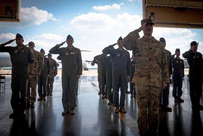 Airmen stand at attention