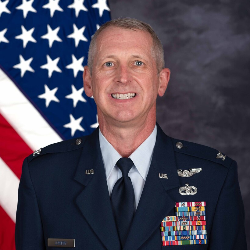 Air Force Col. Craig Lowery, a smiling white man with gray hair in a blue US Air Force dress uniform.