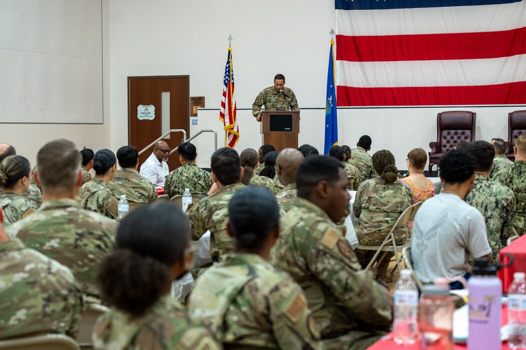 Service members and Luke Air Force Base personnel listen to a guest speaker at a Juneteenth luncheon event, June 16, 2022, at Luke AFB, Arizona.