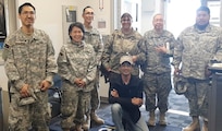 Members of the Alaska State Defense Force assist the Red Cross and Yukon-Kuskokwim Health Corporation in providing essential services to approximately 50 people in the Alaska National Guard armory in Bethel, Alaska, June 18. People from Mt. Village, Pilot Station, Pitkas Point and St. Mary's were relocated to the armory in Bethel as a precaution against wildfires and potential smoke inhalation. (Alaska National Guard Courtesy Photo)