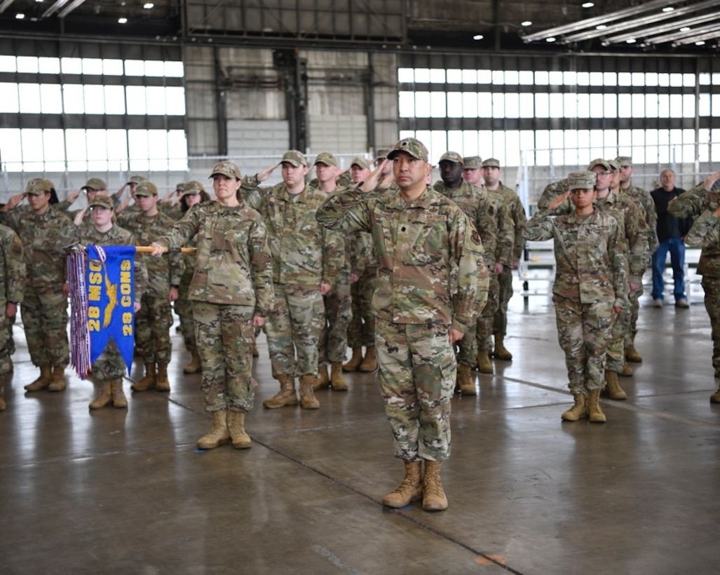 Airmen from the 28th Bomb Wing render a first salute to Col. Patrice Holmes, incoming Mission Support Group commander, during a change of command ceremony at Ellsworth Air Force Base, S.D., June 24, 2022.