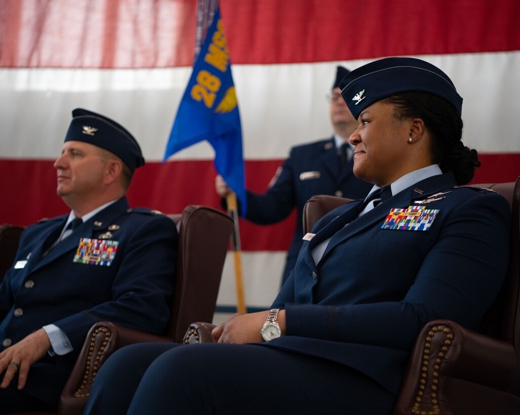 Col. Brady Vaira, the 28th Mission Support Group outgoing commander, and Col. Patrice Holmes, the 28th Mission Support Group incoming commander listen to speeches given during a change of command ceremony at Ellsworth Air Force Base, S.D., June 24, 2022.