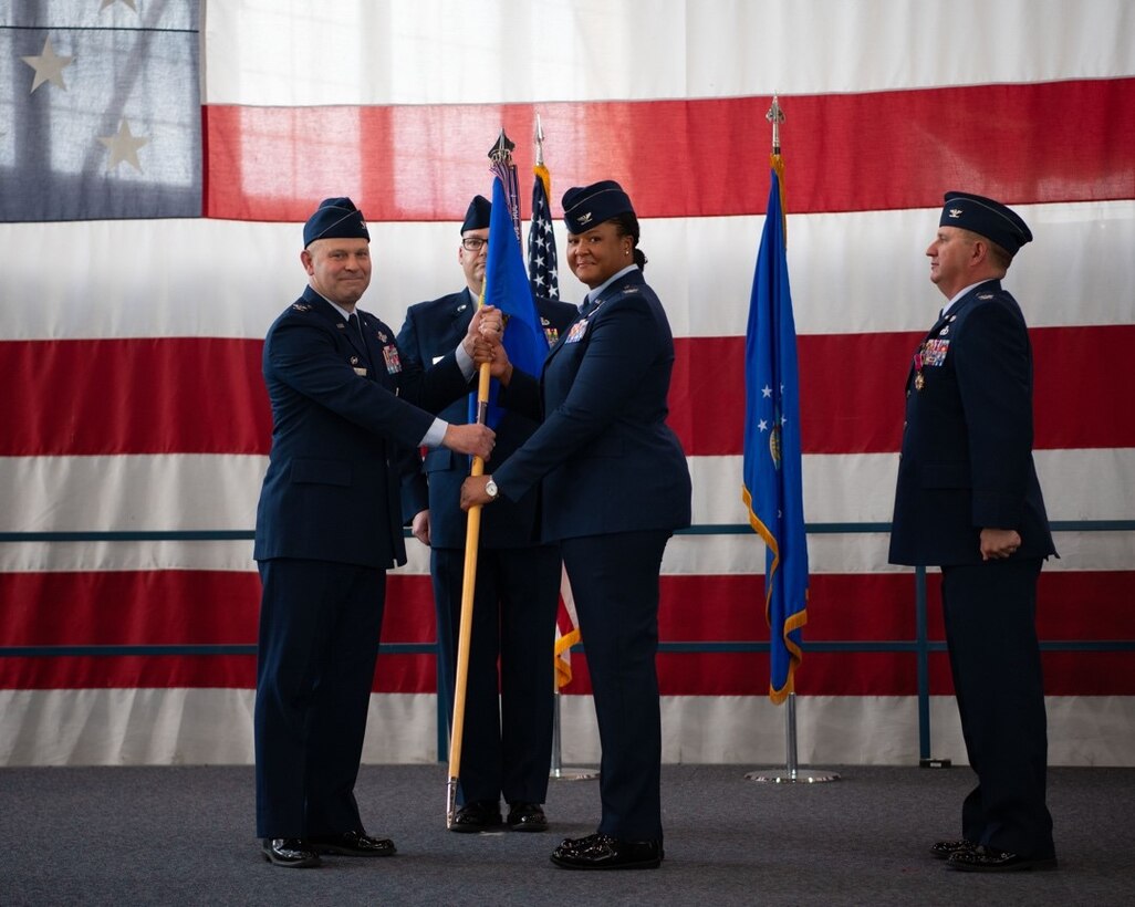 Col. Patrice Holmes the incoming 28th Mission Support Group commander, receives the 28th MSG's guidon at Ellsworth Air Force Base, S.D., June 24, 2022.
