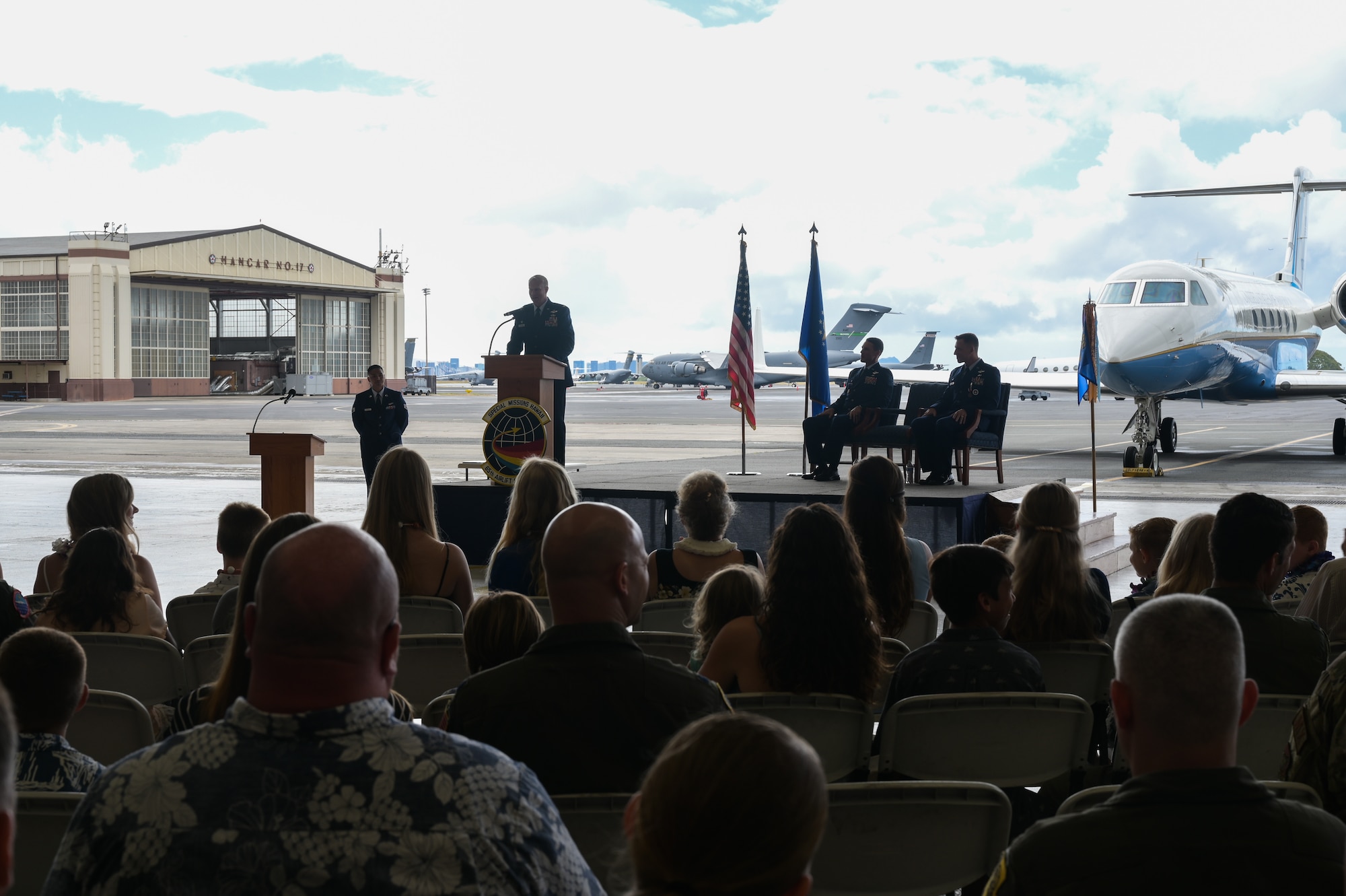 Lt. Col. Daniel Hellinger, 65th Airlift Squadron commander, gives a speech during a change of command ceremony at Joint Base Pearl Harbor-Hickam, Hawaii, June 24, 2022. Hellinger is taking command after serving as the 15th Wing Chief of Safety from June 2021 to June 2022. (U.S. Air Force photo by Staff Sgt. Alan Ricker)