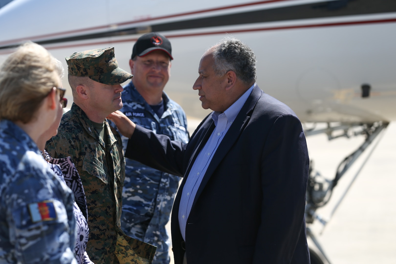 U.S. Secretary of the Navy Carlos Del Toro greets U.S. Marine Corps Col. Christopher Steele, the commanding officer of Marine Rotational Force-Darwin (MRF-D) 22, during a visit with MRF-D 22 at Royal Australian Air Force Base Darwin, June 18, 2022. Secretary Del Toro visited Marines and Sailors with MRF-D 22 and Australian Defence Force personnel as part of the Indo-Pacific battlefield circulation. (U.S. Marine Corps photo by Cpl. Emeline Molla)