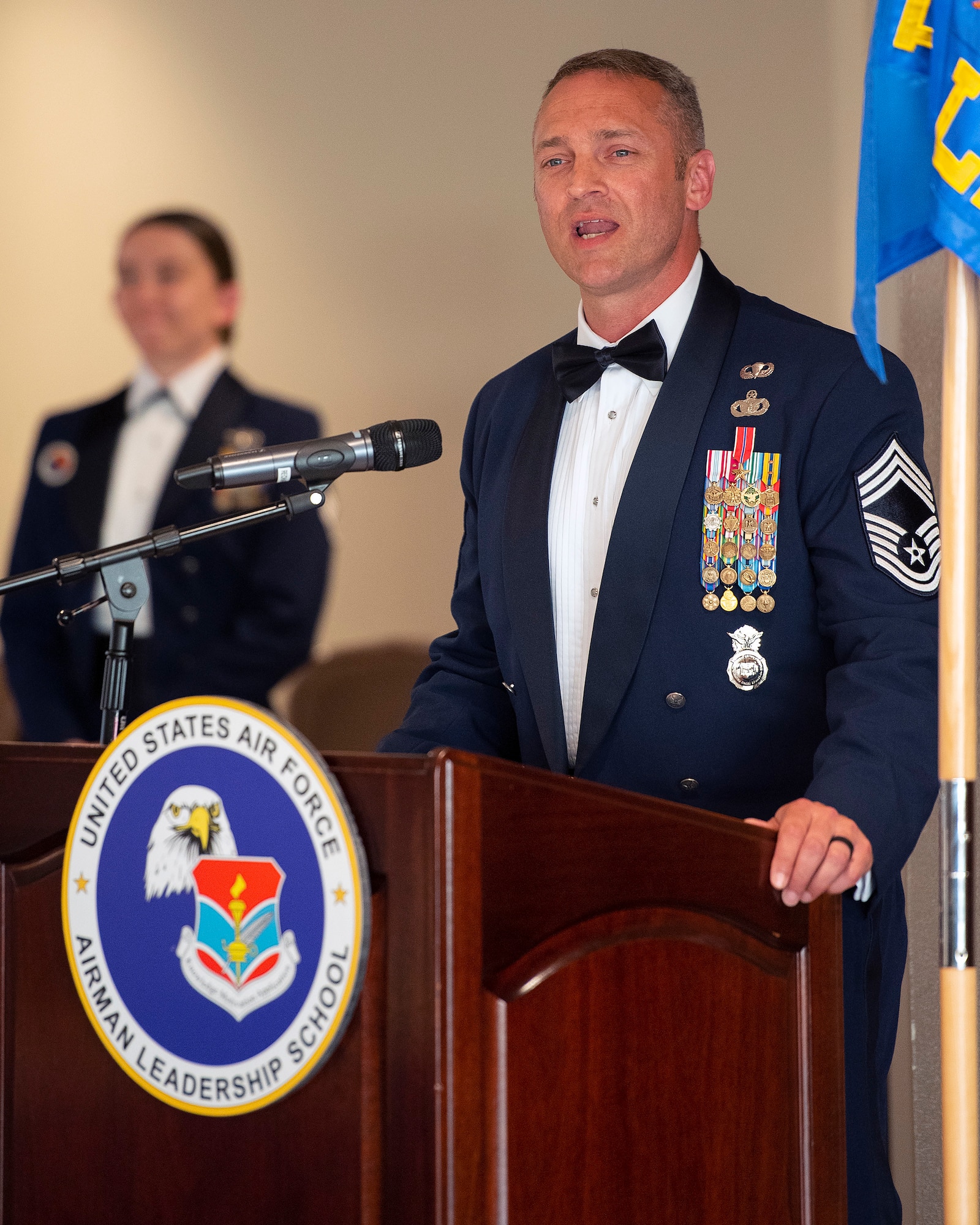 Chief Master Sgt. Justin Walker, 88th Security Forces Squadron senior enlisted leader, speaks at the Chief Master Sgt. Grace A. Peterson Airman Leadership School Class 22-E graduation ceremony, June 16, 2022, at Wright-Patterson Air Force Base, Ohio. Walker was the class’s mentor, providing advice and leadership throughout the course. (U.S. Air Force photo by R.J. Oriez)