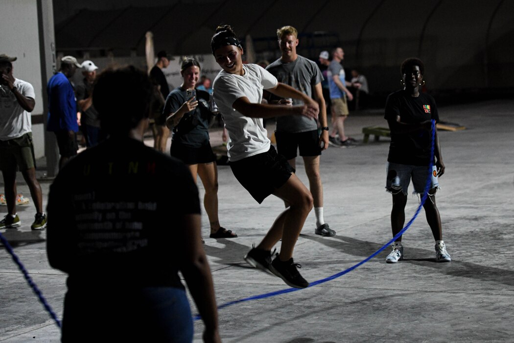 Airmen of the 380th Air Expeditionary Wing play Double Dutch during a Juneteenth celebration, June 19, 2022, at Al Dhafra Air Base, United Arab Emirates. The celebration was held to commemorate the emancipation of slaves in Texas, more than two years after the Emancipation Proclamation, and to provide Airmen an opportunity to learn more about United States history.