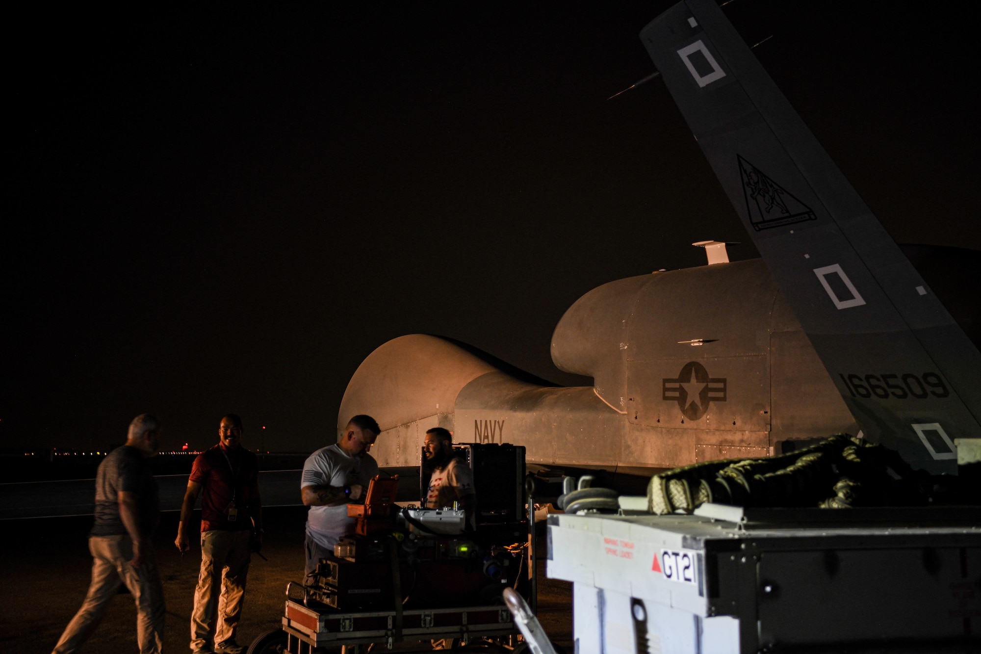 Northrup Grumman contractors perform preflight checks on the last U.S. Navy RQ-4 Global Hawk, attached to the Broad Area Maritime Surveillance Demonstrator mission, June 16, 2022, at Al Dhafra Air Base, United Arab Emirates. The Global Hawk training mission at ADAB was originally scheduled to last six months but mission effectiveness and reliability led to an extension of the mission lasting approximately 13 years.
